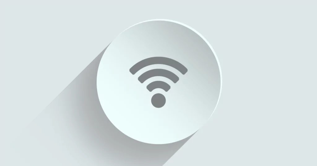 Ein stilisiertes WiFi Symbol auf einem runden weißen Teller. Hintergrund grau